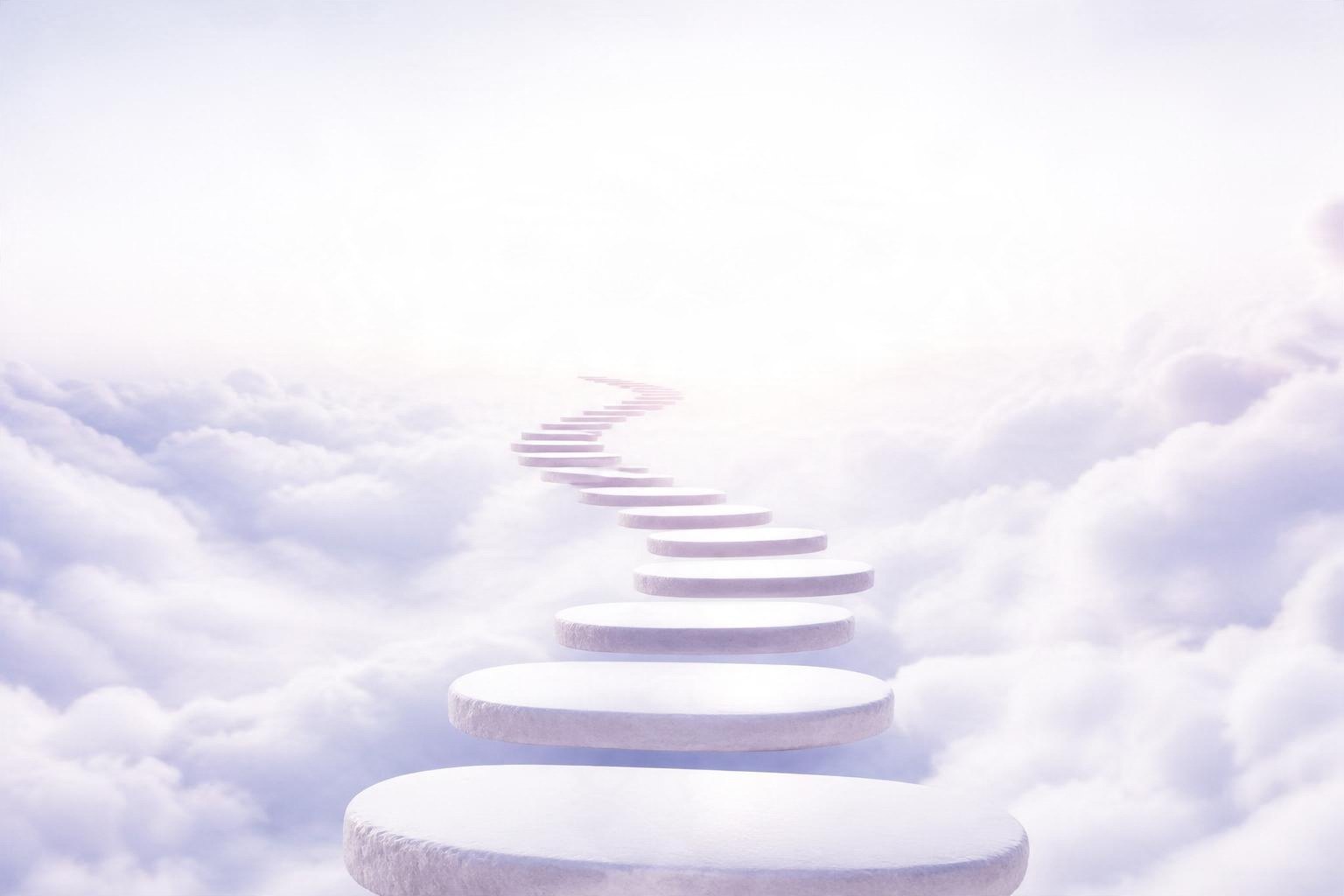 Un camino de piedras blancas sobre las nubes hacia un horizonte luminoso